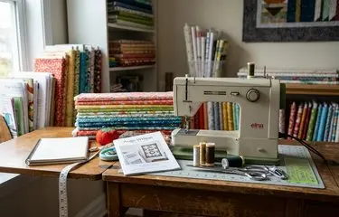 Podcast microphone beside quilt blocks